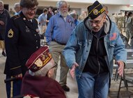 Randall Roberts greets William B. Busier after the POW/MIA Day observance at Camp Johnson, Vermont, on Sept. 16, 2022. POW/MIA Day is observed the third Friday of September to honor veterans who were held as prisoners of war or who were missing in action. Busier was captured by Nazi Germans and held at Stalag Luft 9A for six months. Roberts is former commander of the Col. Donald G. Cook chapter of the Disabled American Veterans charity. (U.S. Army National Guard photo by Don Branum)