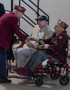 Richard H. Hamilton and William B. Busier speak before the POW/MIA Day observance at Camp Johnson, Vermont, on Sept. 16, 2022. POW/MIA Day is observed the third Friday of September to honor veterans who were held as prisoners of war or who were missing in action. Hamilton was held at Stalag Luft 4 in Poland for 9 months. Busier was held at Stalag Luft 9A for six months. (U.S. Army National Guard photo by Don Branum)