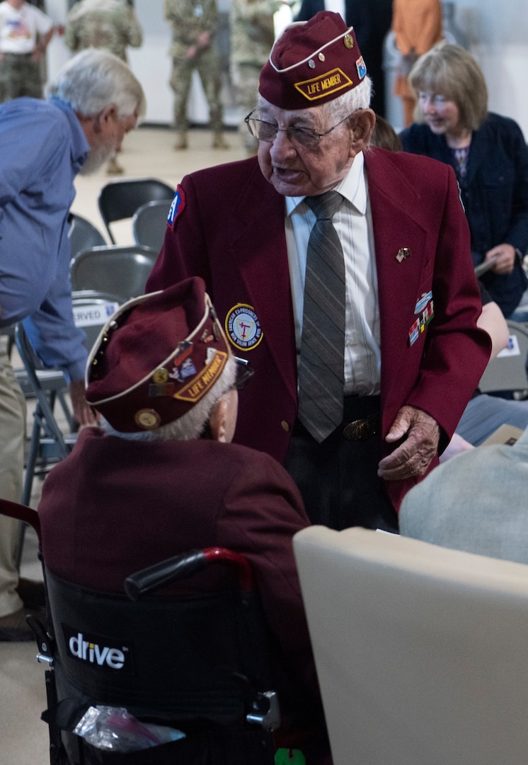 Clyde Cassidy and William Busier speak to each other before the annual POW/MIA Day ceremony at Camp Johnson, Vermont, on Sept. 16, 2022. POW/MIA Day is observed on the third Friday of each September to honor veterans who were held as prisoners of war or who are missing in action. Cassidy was held by Nazis for 15 months, including a 70-day forced march across parts of Europe. Busier was held at Stalag Luft 4 in Poland for nine months. (U.S. Army National Guard photo by Don Branum)