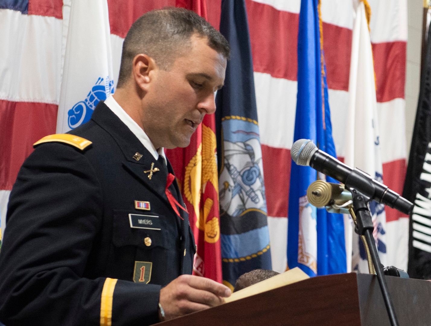 Maj. Travis Myers, secretary for the general staff, Joint Force Headquarters-Vermont National Guard, delivers opening remarks during the POW/MIA Day observance at Camp Johnson, Vermont, on Sept. 16, 2022. POW/MIA Day is observed the third Friday of September to honor veterans who were held as prisoners of war or who were missing in action. (U.S. Army National Guard photo by Don Branum)