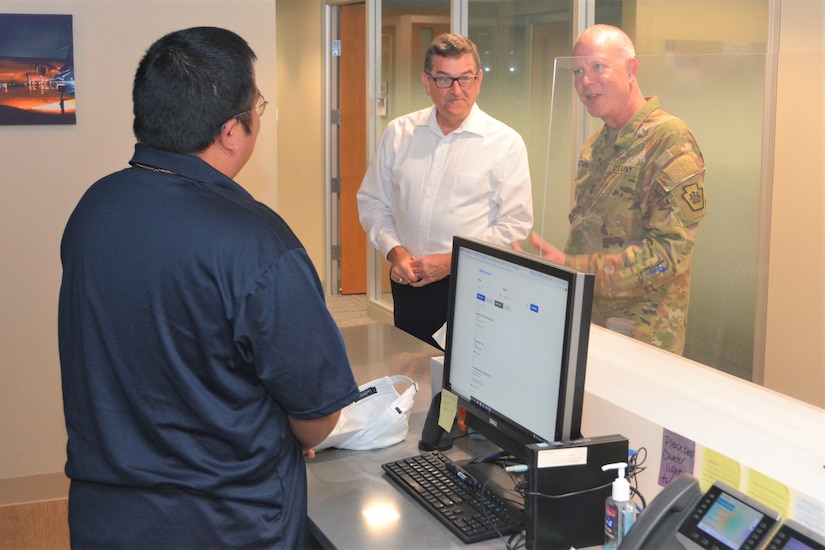 Pennsylvania Adjutant General Maj. Gen. Mark Schindler (right) and Eugene McFeely (center), Penn State’s senior director for veteran affairs and services, talk to a student veteran who works at the Penn State Student Veteran Center on Sept. 16, 2022, in State College, Pa.