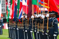 The United States Air Force Honor Guard parades the country flags representing the international air chiefs in attendance at the Air Force 75th Anniversary Tattoo Sept. 15, 2022, at Audi Field, Washington, D.C. The parading of the flags symbolizes the unity and collective power the U.S. has built with its international partners and allies. This display was a part of the celebration of the Air Force’s 75th year. (U.S. Air Force photo by Staff Sgt. Nilsa Garcia)