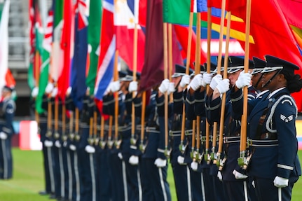 The United States Air Force Honor Guard parades the country flags representing the international air chiefs in attendance at the Air Force 75th Anniversary Tattoo Sept. 15, 2022, at Audi Field, Washington, D.C. The parading of the flags symbolizes the unity and collective power the U.S. has built with its international partners and allies. This display was a part of the celebration of the Air Force’s 75th year. (U.S. Air Force photo by Staff Sgt. Nilsa Garcia)