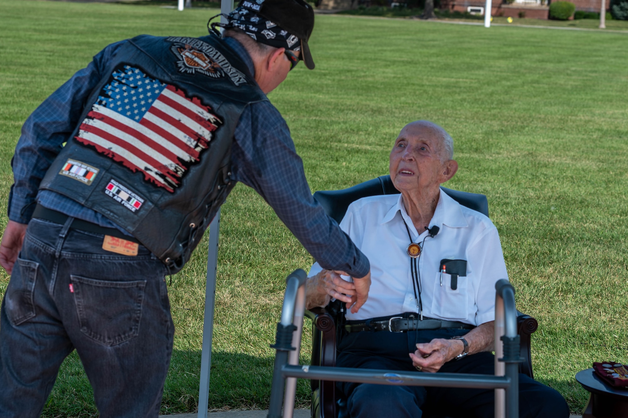 Man gives coin to man