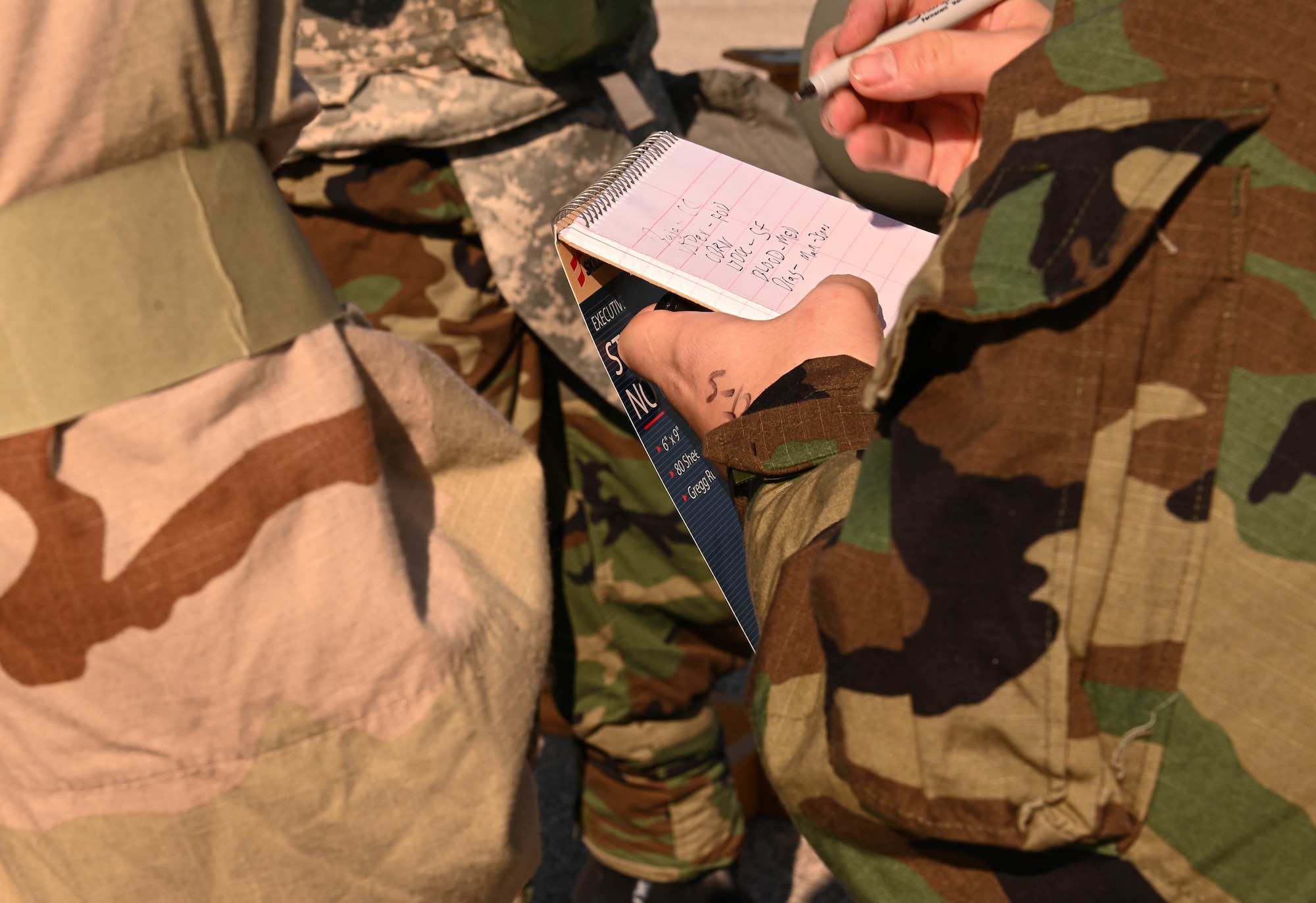 U.S. Air Force Airmen transcribes information for a CBRN exercise at Whiteman Air Force Base, Missouri, September 15, 2022. Airmen participate in the chemical, biological, and nuclear (CBRN) attack to ensure readiness in the case of an attack. (U.S. Air Force photo by Airman 1st Class Hailey Farrell)