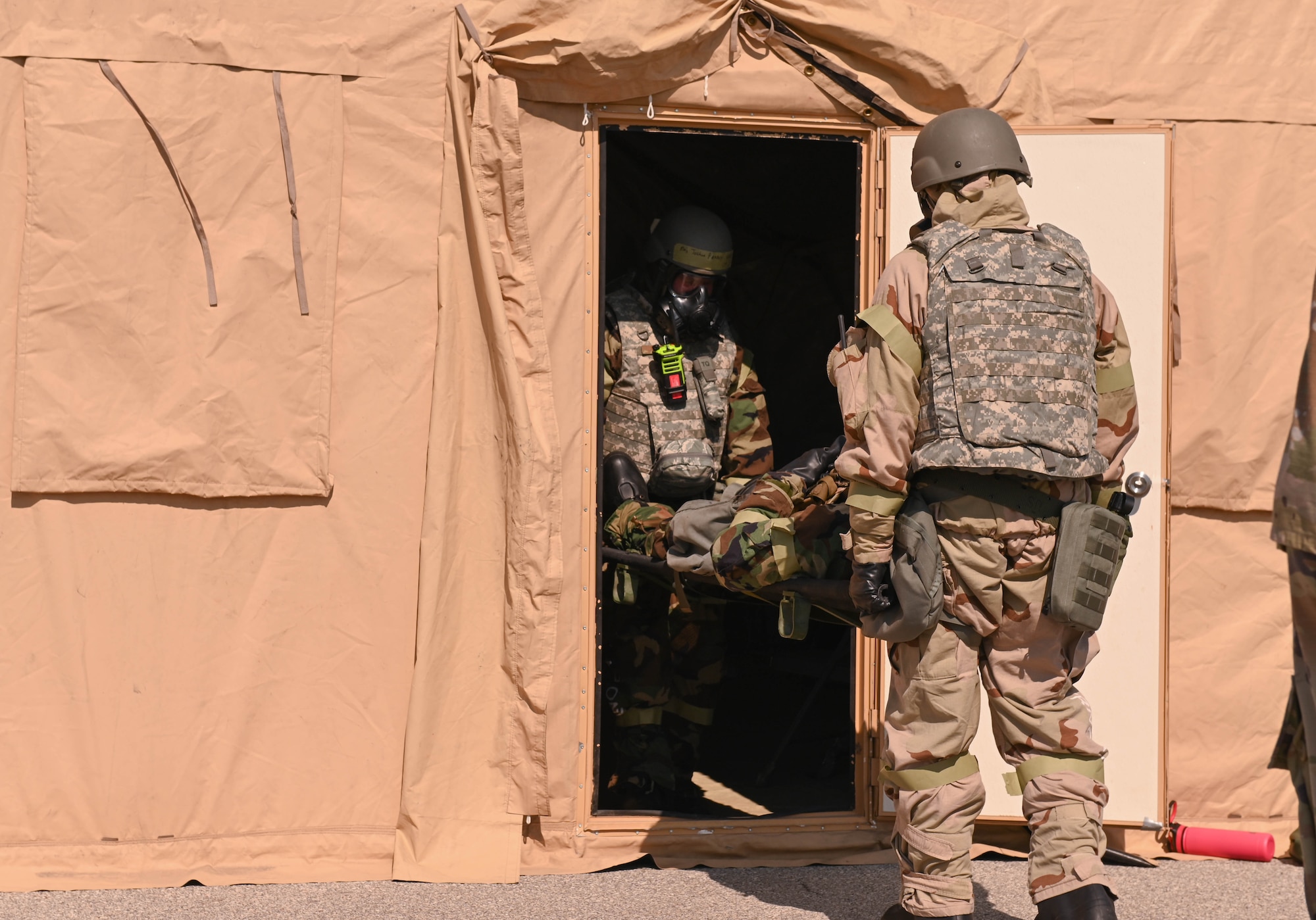 U.S. Air Force Airmen from the 509th Medical Group perform a litter carry of an Airmen at Whiteman Air Force Base, Missouri, September 15, 2022. This exercise ensures Airmen at Whiteman Air Force Base are prepared to protect themselves and their wingmen. (U.S. Air Force photo by Airman 1st Class Hailey Farrell)