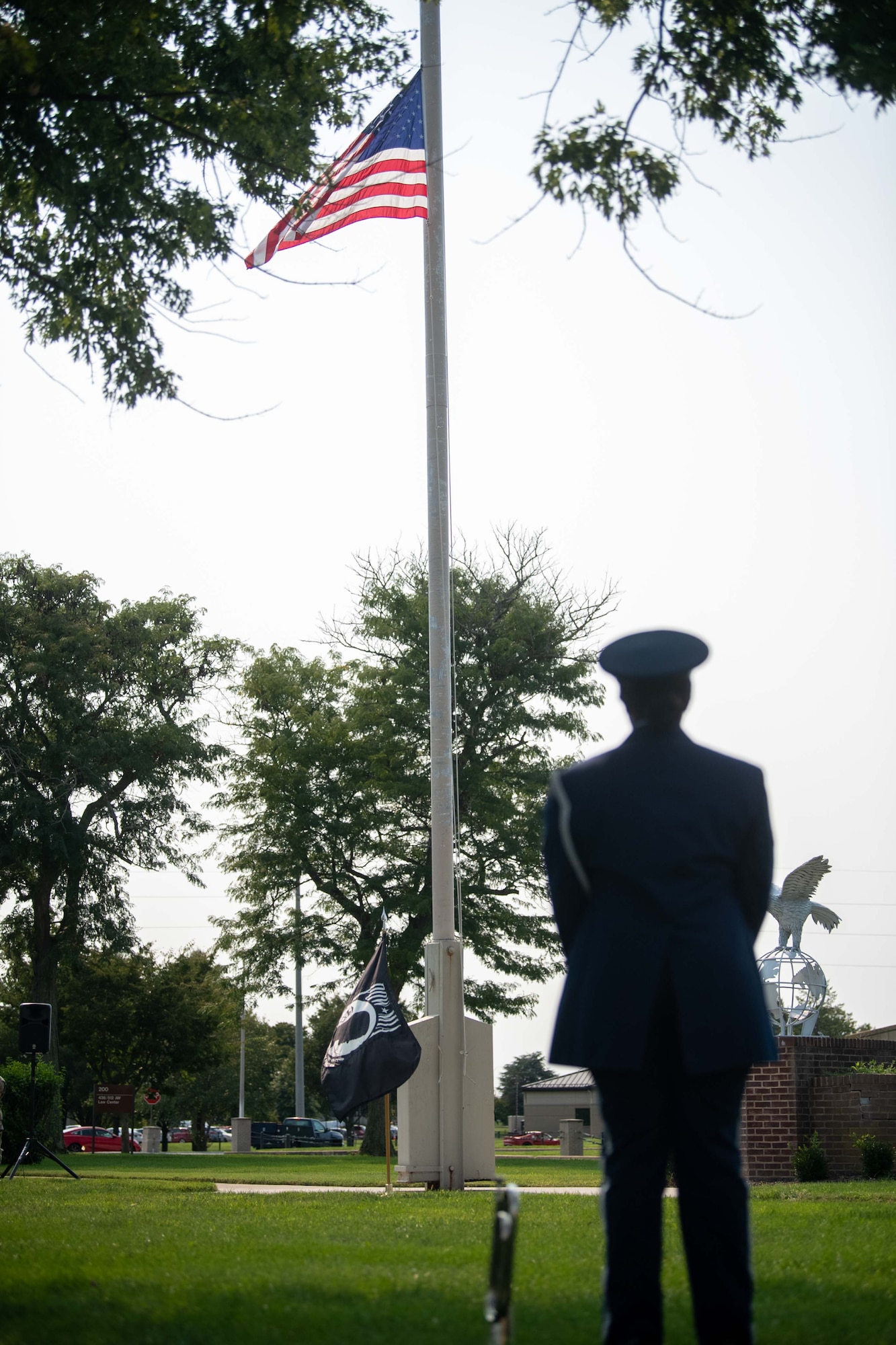 Airman 1st Class Garvey Quinn, Dover Air Force Base Honor Guard member, waits to play taps during a retreat ceremony commemorating National POW/MIA Recognition Day at Dover AFB, Delaware, Sept. 16, 2022. Taps is a bugle call played during military funerals. (U.S. Air Force photo by Senior Airman Faith Barron)