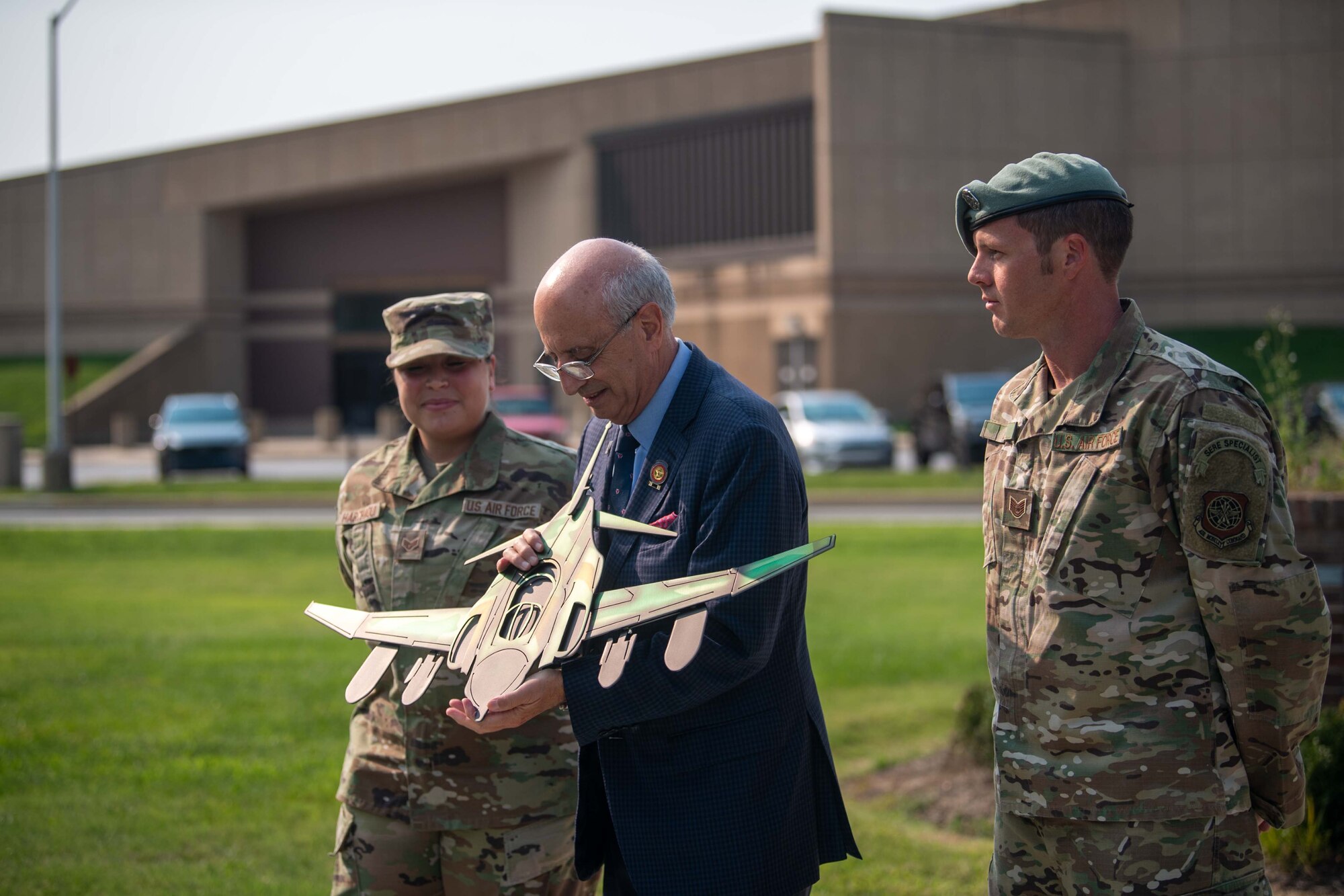 Team Dover members present a gift to Ralph Galati, Air Force veteran and former prisoner of war, at a retreat ceremony commemorating National POW/MIA Recognition Day on Dover Air Force Base, Delaware, Sept. 16, 2022. Galati was shot down over North Vietnam in 1972 and was a POW for 14 months. (U.S. Air Force photo by Senior Airman Faith Barron)