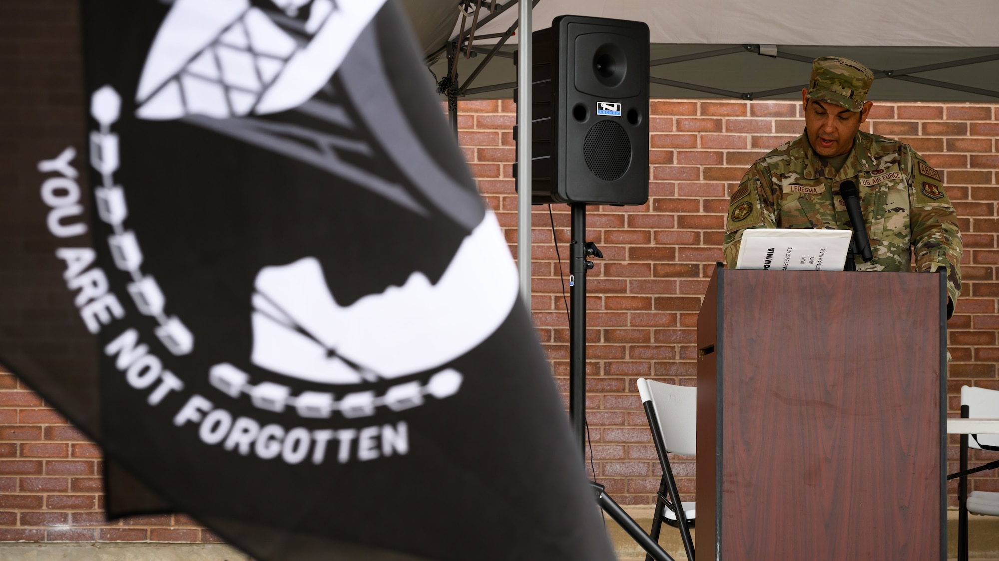 Tech. Sgt. Abelino Ledesma, 309th Expeditionary Depot Maintenance, reads names of missing service members during POW/MIA Remembrance Week at Hill Air Force Base, Utah, Sept. 13, 2022.