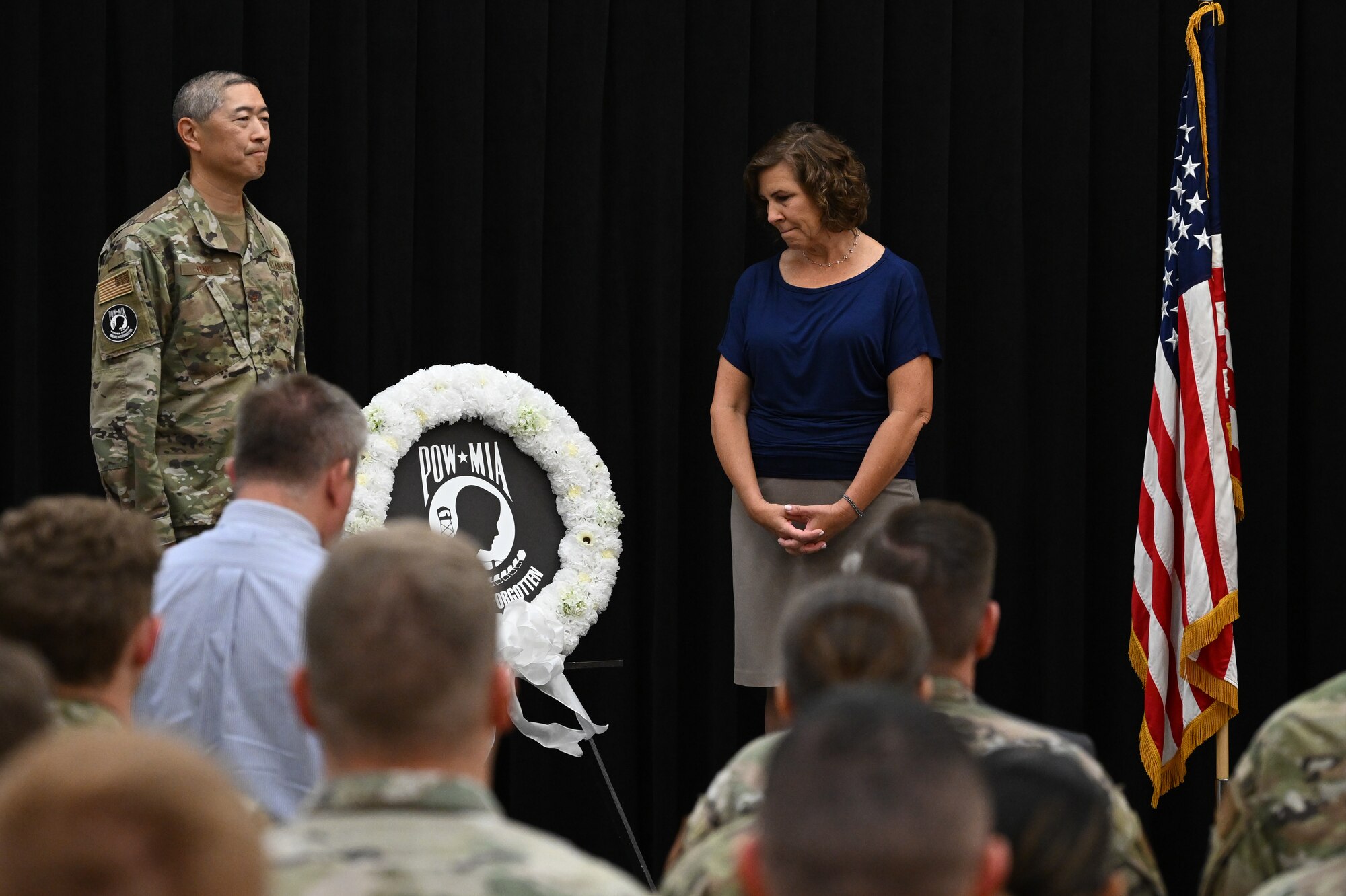 Col. Peter Feng, 75th Air Base Wing vice commander, and Stephanie Galley, League of POW/MIA Families, present a wreath during Team Hill's POW/MIA Remembrance Week closing ceremony at Hill Air Force Base, Utah, Sept. 16, 2022.