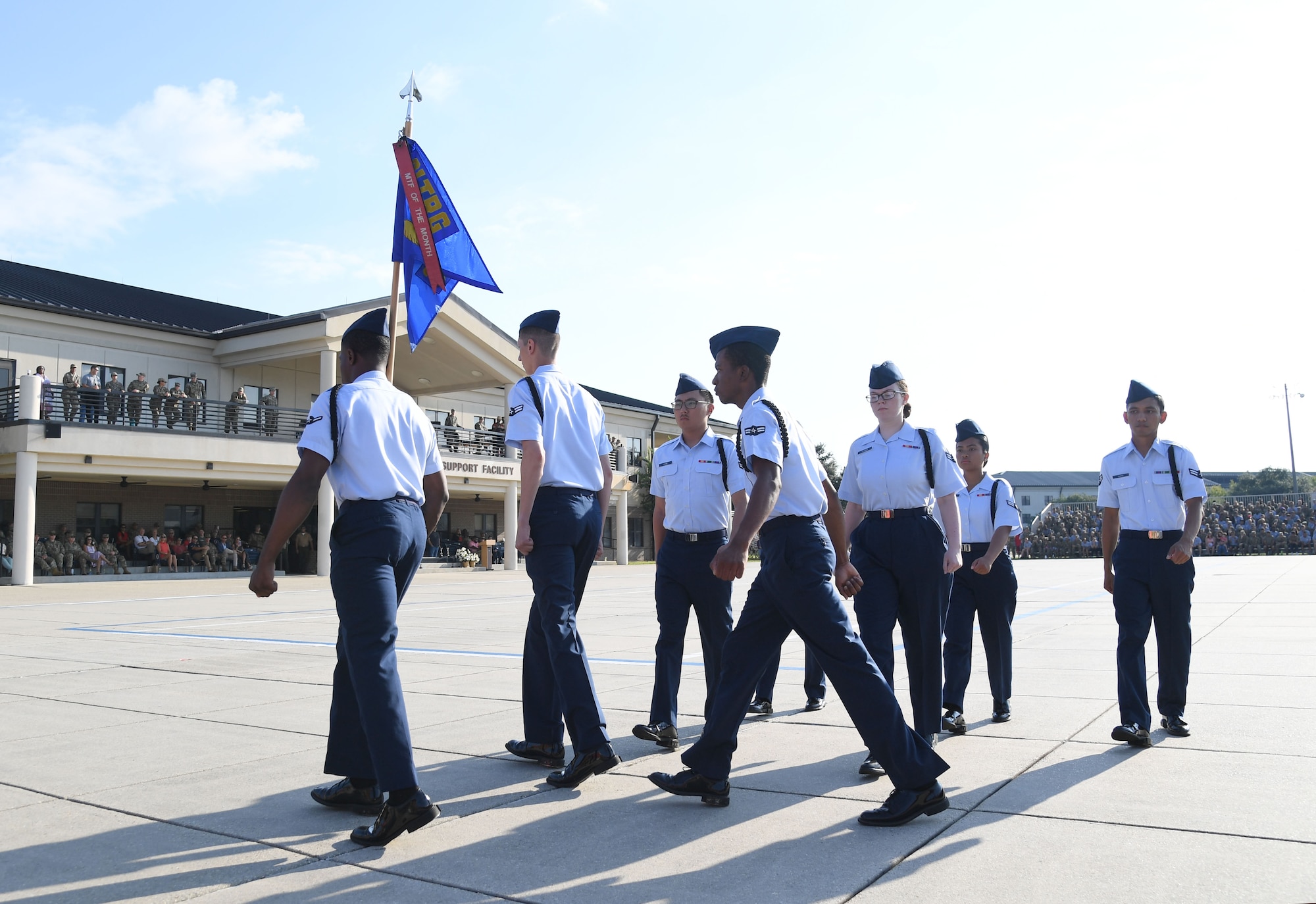 Members of the 335th Training Squadron regulation drill team perform during the 81st Training Group drill down on the Levitow Training Support Facility drill pad at Keesler Air Force Base, Mississippi, Sept. 16, 2022. Keesler trains more than 30,000 students each year. While in training, Airmen are given the opportunity to volunteer to learn and execute drill down routines. (U.S. Air Force photo by Kemberly Groue)