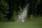 Air Force 1st Lt. Kimberly Lui of Minot AFB, N.D. lands an amazing shot out of the bunker for par during the final day of the 2022 Armed Forces Golf Championship hosted by Army at Fort Belvoir, Virgina.  Championship features teams from the Army, Marine Corps, Navy (with Coast Guard players), and Air Force (with Space Force players).  Department of Defense Photo by Mr. Steven Dinote - Released.