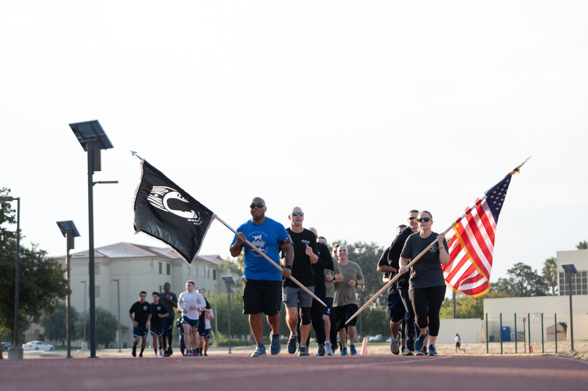 Airmen running with flag