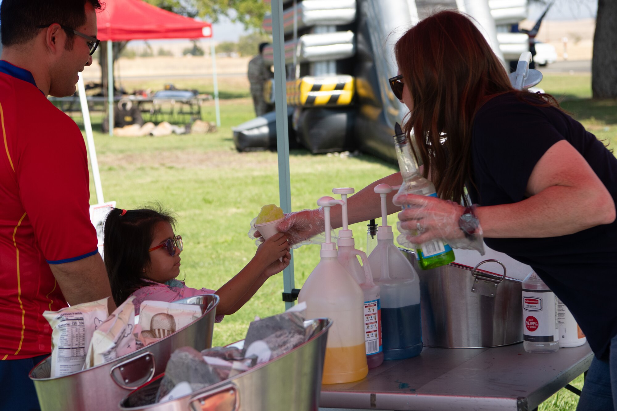 The Beale Air Force Base United Services Organization passes out snow cones for Recce Connect Day at Beale Air Force Base, Cali. on Sept. 16, 2022.