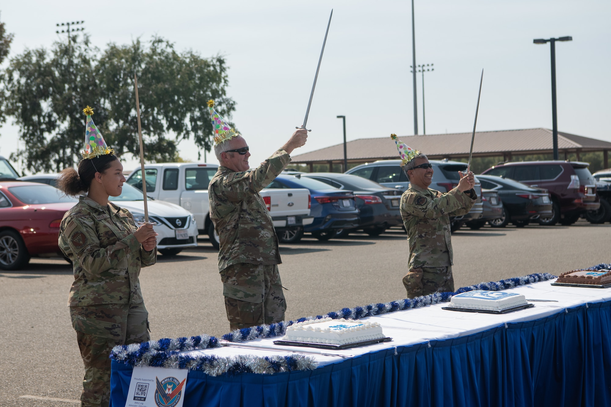 Col. Jason Eckberg (middle), Chaplain Mario (right) perform a cake cutting ceremony at Beale Air Force Base, Cali. on Sept. 16, 2022.