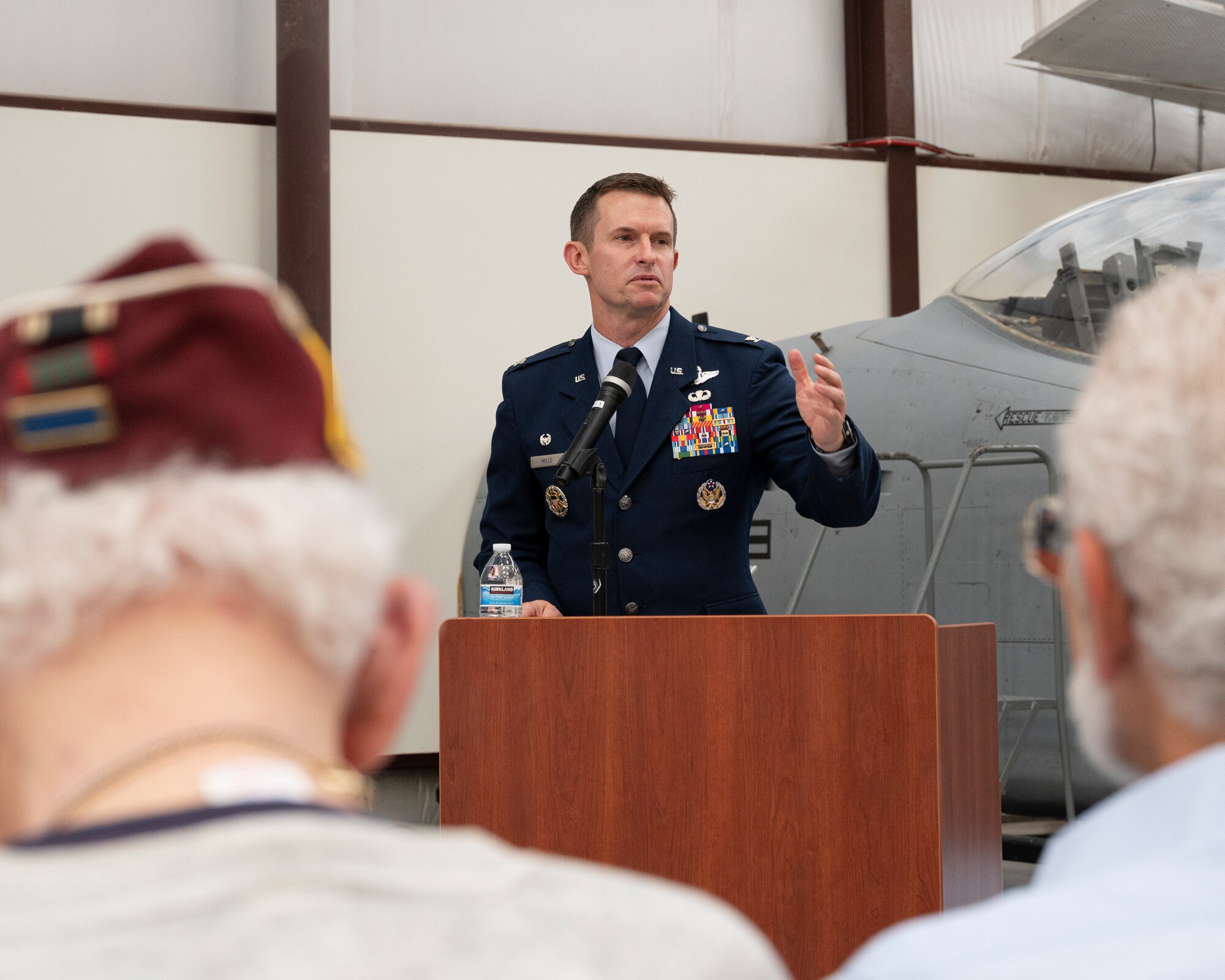 A picture of a man at a podium talking