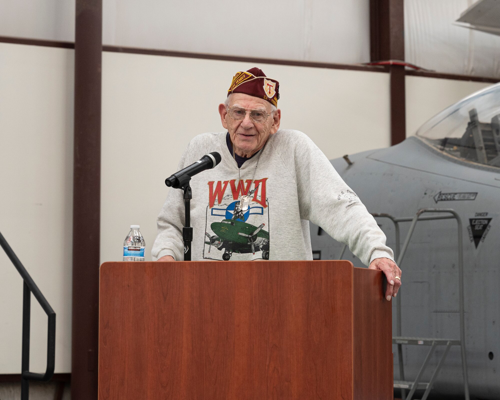 A picture of an old man at a podium
