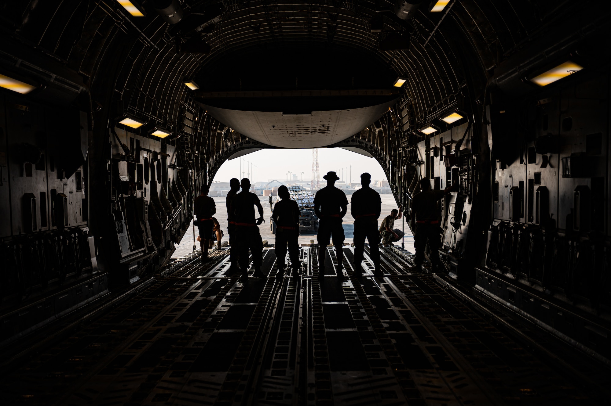 U.S. military personnel assigned to United States Central Command load critical supplies into a U.S. Air Force C-17A Globemaster III aircraft in support of a USAID-led humanitarian mission to Pakistan from Al Udeid Air Base, Qatar, Sep. 14, 2022. USAID leads the U.S. Government's international development and disaster assistance, helping people emerge from humanitarian crises, such as the catastrophic flooding currently plaguing Pakistan. (U.S. Air Force photo by Staff Sgt. Dana Tourtellotte)