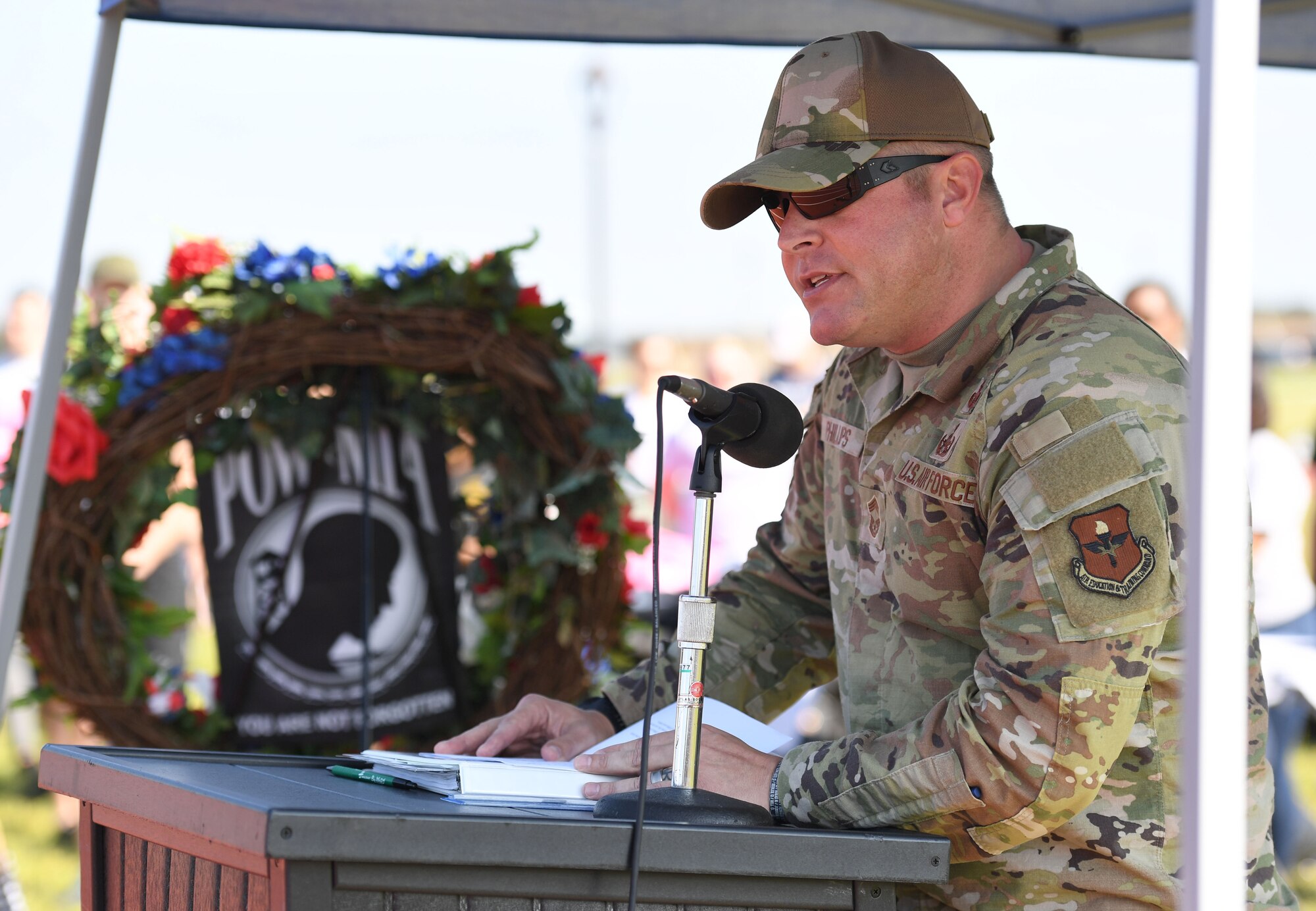 U.S. Air Force Chief Master Sgt. Jeremy Phillips, 81st Training Group senior enlisted leader, delivers remarks during the POW/MIA run and vigil at the triangle track on Keesler Air Force Base, Mississippi, Sept. 16, 2022. The event, hosted by the Air Force Sergeants Association Chapter 652, is held annually to raise awareness and pay tribute to all prisoners of war and the military members still missing in action. (U.S. Air Force photo by Kemberly Groue)