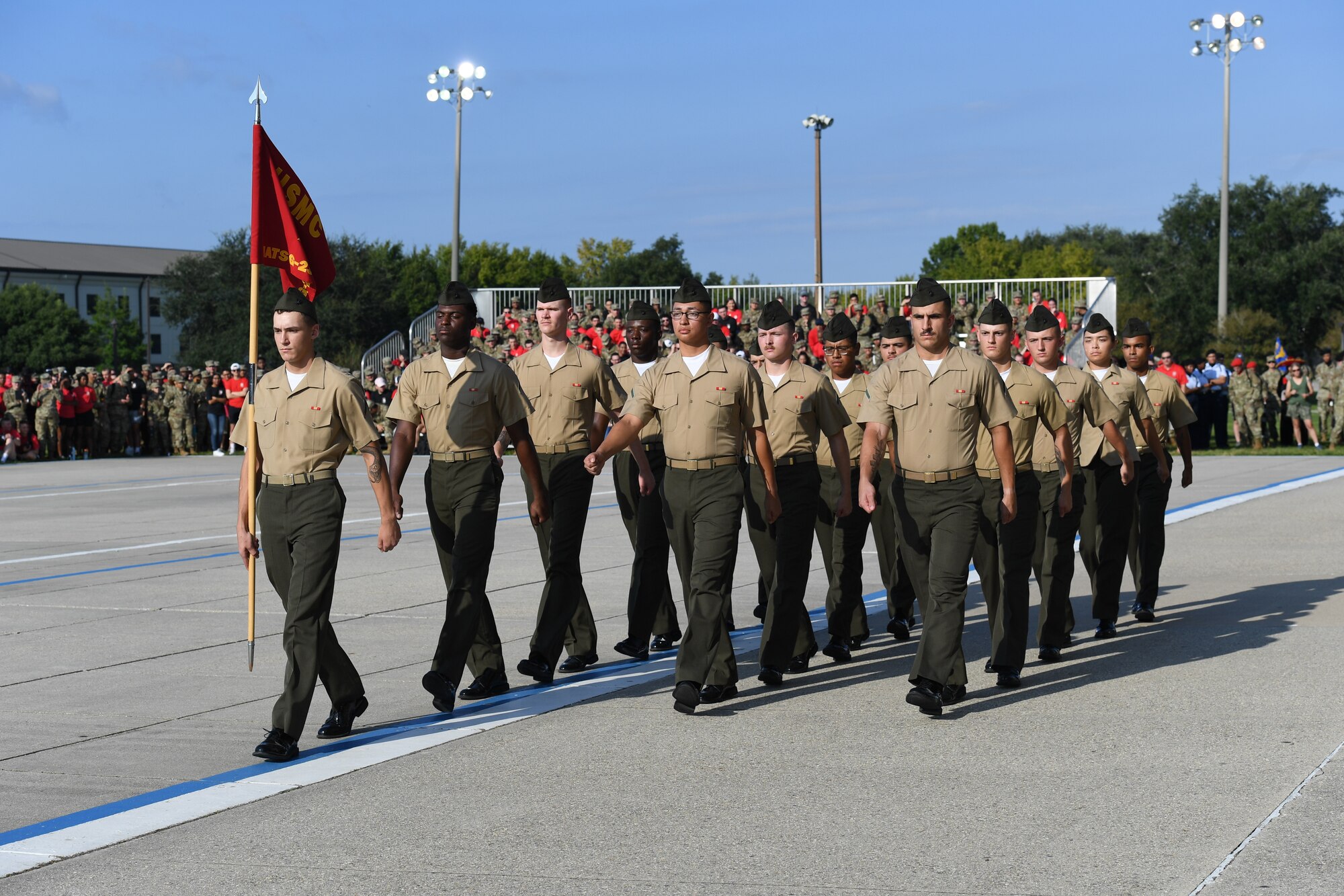 Members of the Keesler Marine Detachment regulation drill team perform during the 81st Training Group drill down on the Levitow Training Support Facility drill pad at Keesler Air Force Base, Mississippi, Sept. 16, 2022. Keesler trains more than 30,000 students each year. While in training, Airmen are given the opportunity to volunteer to learn and execute drill down routines. (U.S. Air Force photo by Kemberly Groue)