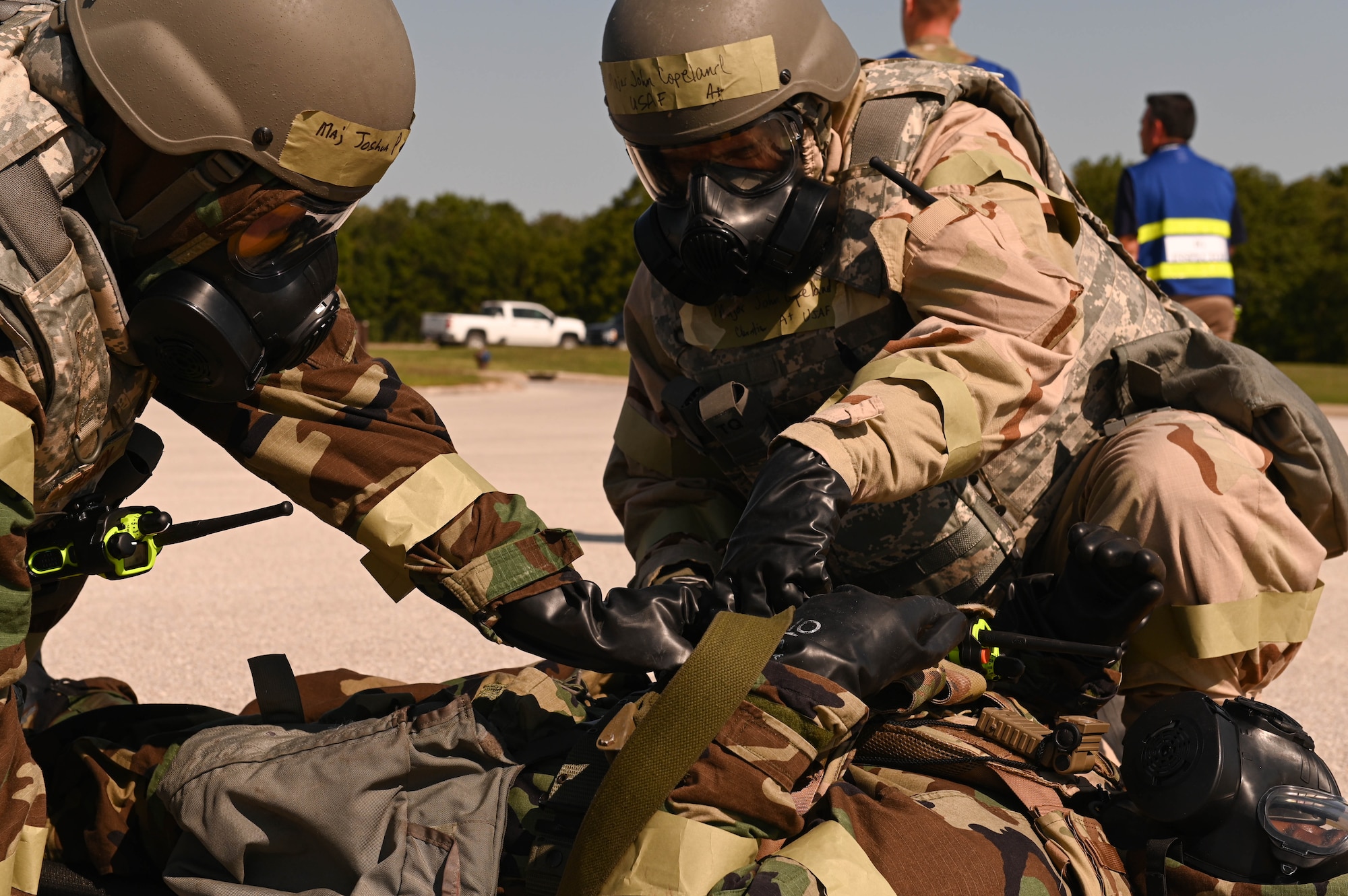 U.S. Air Force Airmen from the 509th Medical Group respond to a simulated injury during a CBRN exercise at Whiteman Air Force Base, Missouri, September 15, 2022. Airmen from the 509th Medical Group participated to strengthen their knowledge. (U.S. Air Force photo by Airman 1st Class Hailey Farrell)