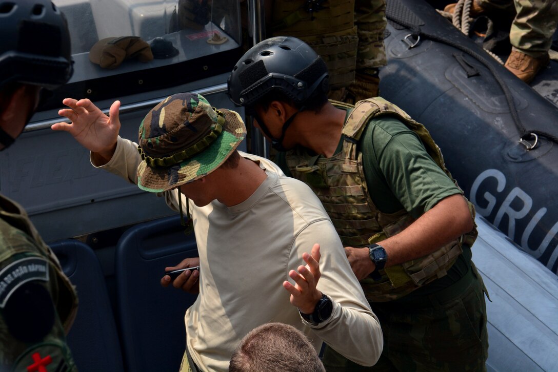 RIO DE JANEIRO – Members of a U.S. Navy Special Boat Team trains Brazilian counterparts on the steps and procedures of a visit, board, search, and seizure (VBSS) during UNITAS LXIII, Sept. 13, 2022. UNITAS is the world’s longest-running maritime exercise. Hosted this year by Brazil, it brings together multinational forces from Belize, Brazil, Cameroon, Chile, Colombia, Dominican Republic, Ecuador, France, Guyana, Jamaica, Mexico, Namibia, Panama, Paraguay, Peru, South Korea, Spain, United Kingdom, Uruguay, and the United States conducting operations in and off the coast of Rio de Janeiro. The exercise trains forces to conduct joint maritime operations through the execution of anti-surface, anti-submarine, anti-air, amphibious and electronic warfare operations that enhance warfighting proficiency and increase interoperability among participating naval and marine forces. (U.S. Navy photo by Mass Communication Specialist 3rd Class Jahlena Royer/Released)