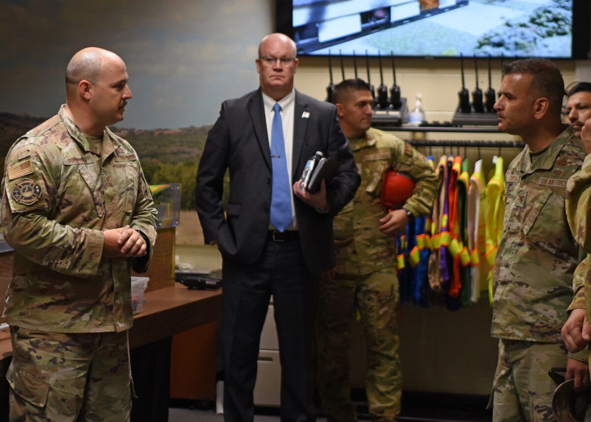 U.S. Air Force Tech Sgt. Anthony Fruehan, 312th Training Squadron instructor, briefs Col. Nicholas Dipoma, Second Air Force vice commander, on firefighter education at the Louis F. Garland Department of Defense Fire Academy, Goodfellow Air Force Base, Texas, Sept. 14, 2022.  Goodfellow’s Fire Academy trains DoD firefighting students for emergency situations using various training structures and assets. (U.S. Air Force photo by Senior Airman Ethan Sherwood)