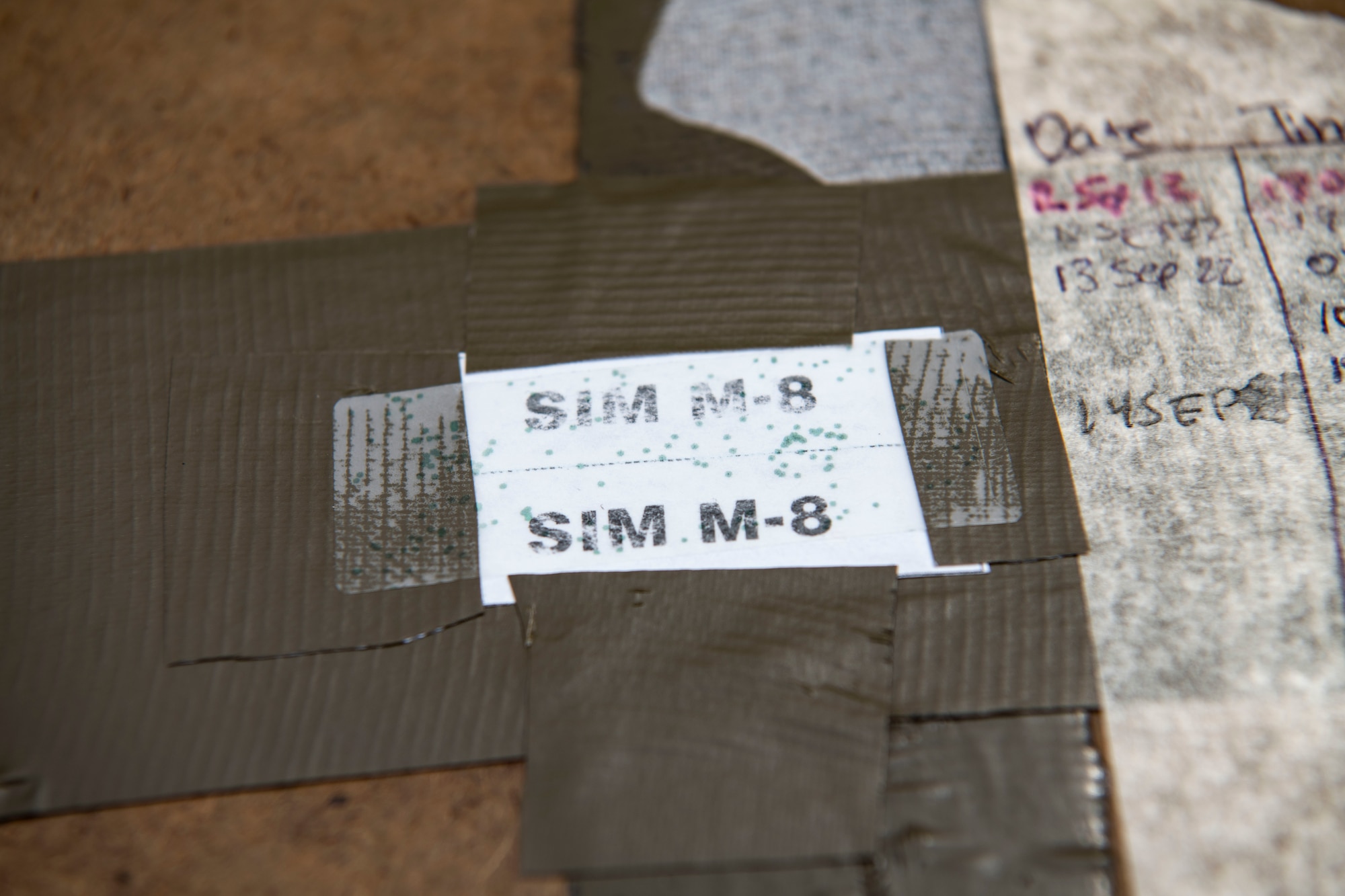 A simulated M-8 chemical detection paper reads training marks during a training event at Kunsan Air Base, Republic of Korea, Sept. 14, 2022. After chemical agents are detected by personnel, bioenvironmental engineering and emergency management flights deploy to conduct a more thorough test of which contaminant is present. (U.S. Air Force photo by Staff Sgt. Sadie Colbert)