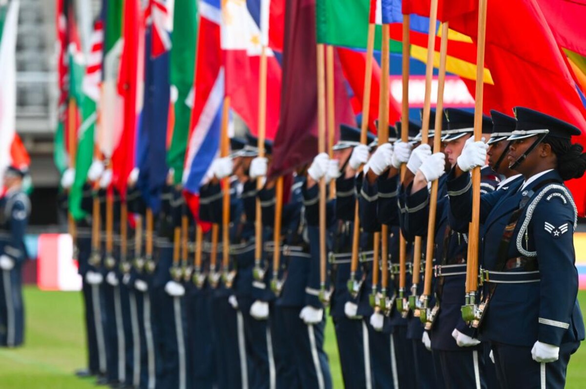 The United States Air Force Honor Guard parades the country flags representing the international air chiefs in attendance at the Air Force 75th Anniversary Tattoo Sept. 15, 2022, at Audi Field, Washington, D.C. The parading of the flags symbolizes the unity and collective power the U.S. has built with its international partners and allies. This display was a part of the celebration of the Air Force’s 75th year. (U.S. Air Force photo by Staff Sgt. Nilsa Garcia)