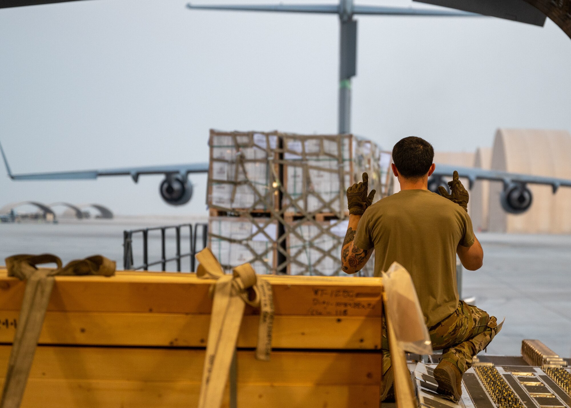 U.S. military personnel assigned to United States Central Command load critical supplies in support of a USAID-led humanitarian mission to Pakistan Air Base Nur Khan, Pakistan, Sep 9, 2022. USAID leads the U.S. Government's international development and disaster assistance, helping people emerge from humanitarian crises, such as the catastrophic flooding currently plaguing Pakistan. This USAID-led delivery was the first of many to be distributed at several locations throughout the country. (U.S. Air Force photo by Staff Sgt. Charles T. Fultz)