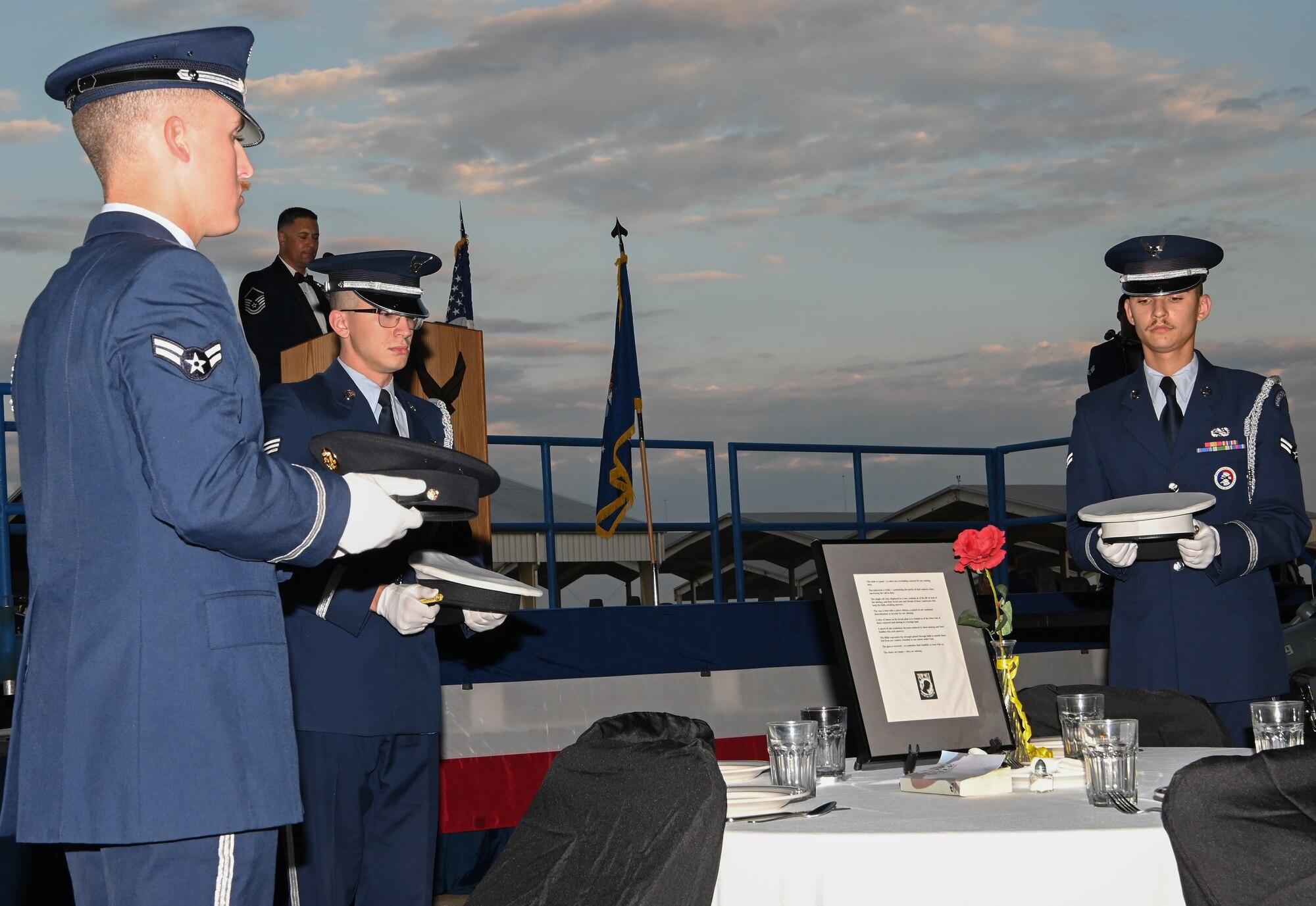 Members of Whiteman Honor Guard present the different wheel caps of the four military branches at the Air Force Ball at Whiteman Air Force Base, Missouri, September 16, 2022. The POW-MIA table ceremony acknowledges those who were POWs or MIA from all four branches of military. (U.S. Air Force photo by Airman 1st Class Joseph Garcia)