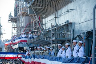 Sailors man the rails aboard USS Monterey (CG 61) during its decommissioning ceremony at Naval Station Norfolk.