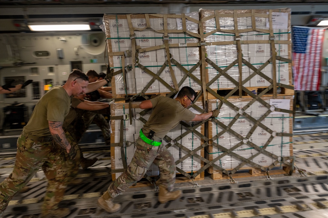 U.S. military personnel assigned to United States Central Command deliver critical supplies in support of a USAID-led humanitarian mission at Pakistan Air Base Nur Khan, Pakistan, Sep 9, 2022. USAID leads the U.S. Government's international development and disaster assistance, helping people emerge from humanitarian crises, such as the catastrophic flooding currently plaguing Pakistan. This USAID-led delivery was the first of many to be distributed at several locations throughout the country. (U.S. Air Force photo by Staff Sgt. Charles T. Fultz)