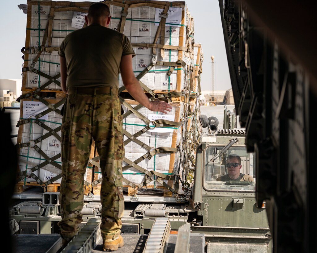 U.S. military personnel assigned to United States Central Command load critical supplies at Al Dhafra Air Base, United Arab Emirates, in support of a USAID-led humanitarian mission in Pakistan, Sep. 11, 2022. USAID leads the U.S. Government's international development and disaster assistance, helping people emerge from humanitarian crises, such as the catastrophic flooding currently plaguing Pakistan. (U.S. Air Force photo by Tech. Sgt. Isaac D. Garden)