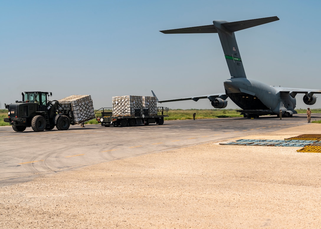 U.S. military personnel assigned to United States Central Command deliver critical aid in support of a USAID-led humanitarian mission at Sukkur Airport, Pakistan, Sep 11, 2022. USAID leads the U.S. Government's international development and disaster assistance, helping people emerge from humanitarian crises, such as the catastrophic flooding currently plaguing Pakistan. This USAID-led delivery was the first of many to be distributed at several locations throughout the country. (U.S. Air Force photo by Tech. Sgt. Isaac D. Garden)