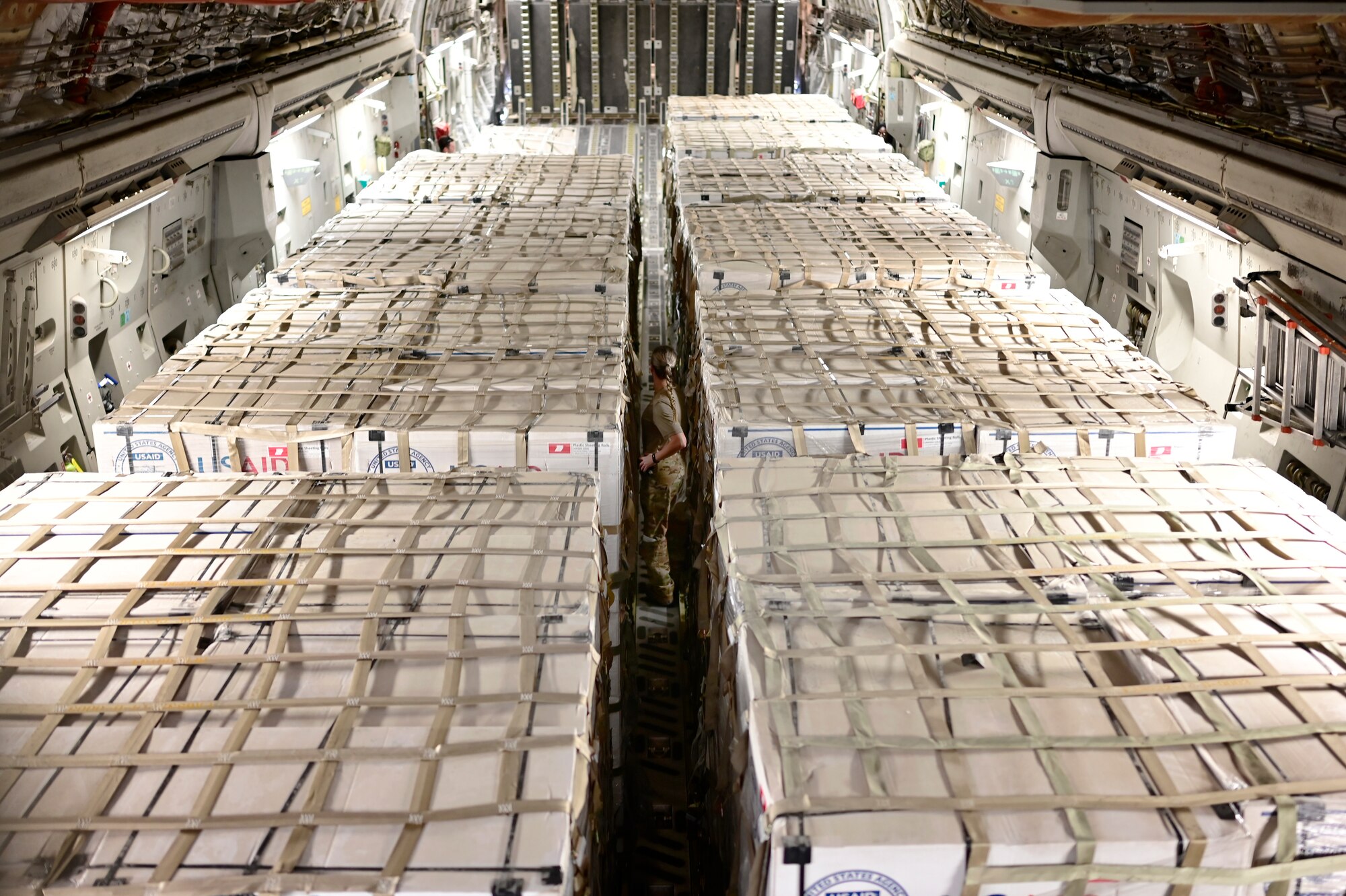 U.S. military personnel assigned to United States Central Command deliver critical supplies in support of a USAID-led humanitarian mission to Pakistan, Sep. 10, 2022. USAID leads the U.S. Government's international development and disaster assistance, helping people emerge from humanitarian crises, such as the catastrophic flooding currently plaguing Pakistan. (U.S. Air Force photo by Master Sgt. Matthew Plew)