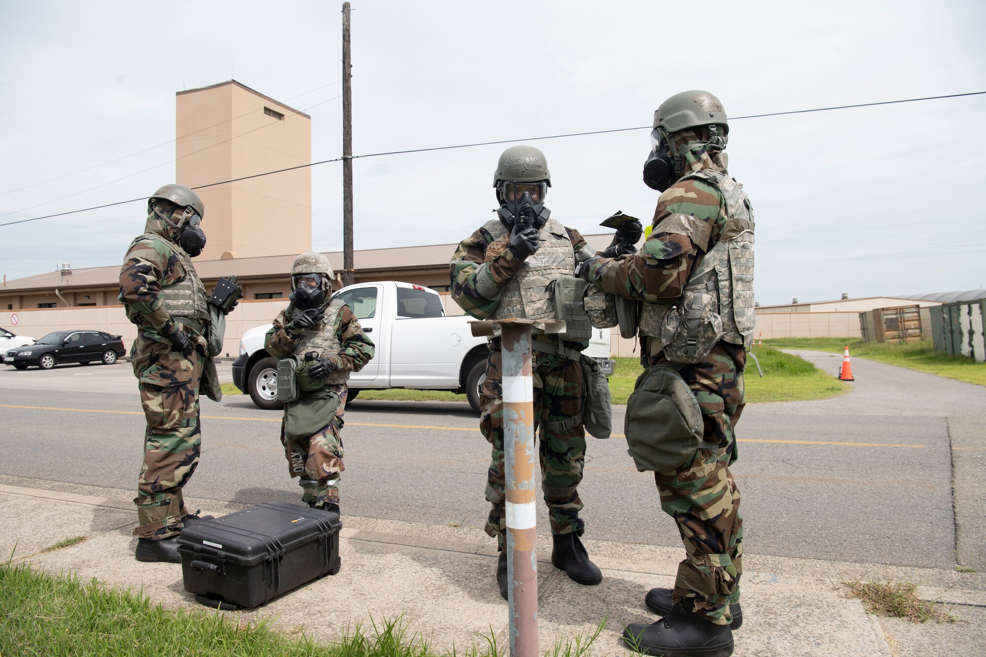 U.S. Air Force 8th Civil Engineer Squadron emergency management (left) and 8th Healthcare Operations Squadron bioenvironmental engineering flight teams, test for contaminants during a training event at Kunsan Air Base, Republic of Korea, Sept. 14, 2022. Following the simulated chemical agent attack, the teams were sent out to further identify the type of chemical agent present and followed up with a containment plan to ensure the simulated attack did not impact the installation’s mission. (U.S. Air Force photo by Staff Sgt. Sadie Colbert)