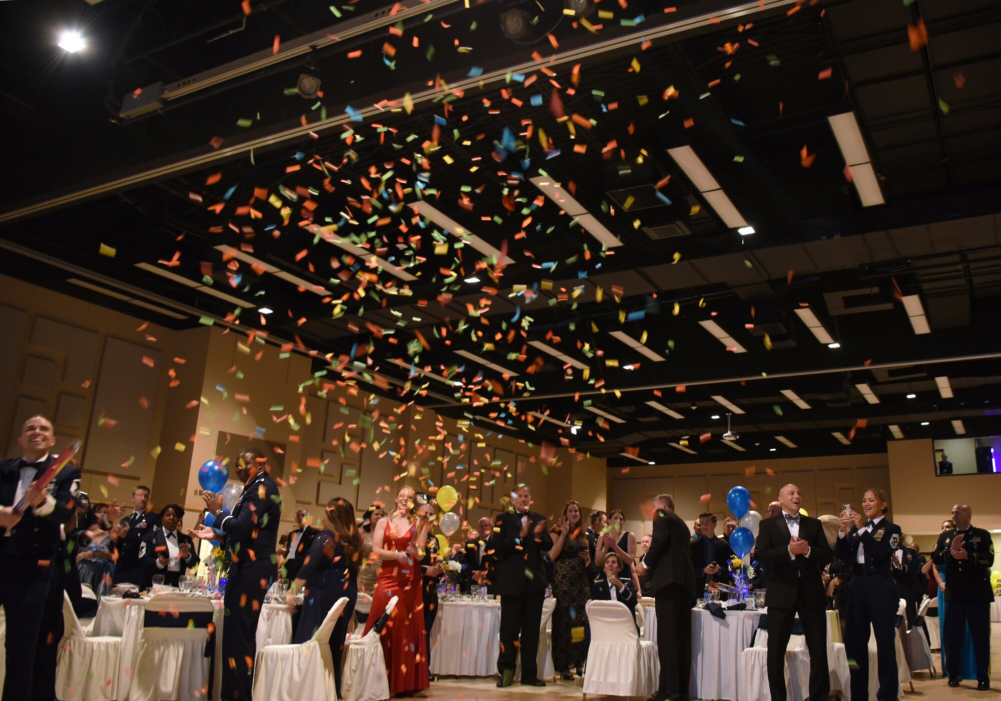 Members assigned to the 17th Training Wing celebrate with confetti at the annual Air Force Ball, at the McNease Convention Center, in San Angelo, Texas, Sept. 17, 2022. The ball recognized the Air Force’s momentous 75th anniversary. (U.S Air Force Photo by Senior Airman Abbey Rieves)