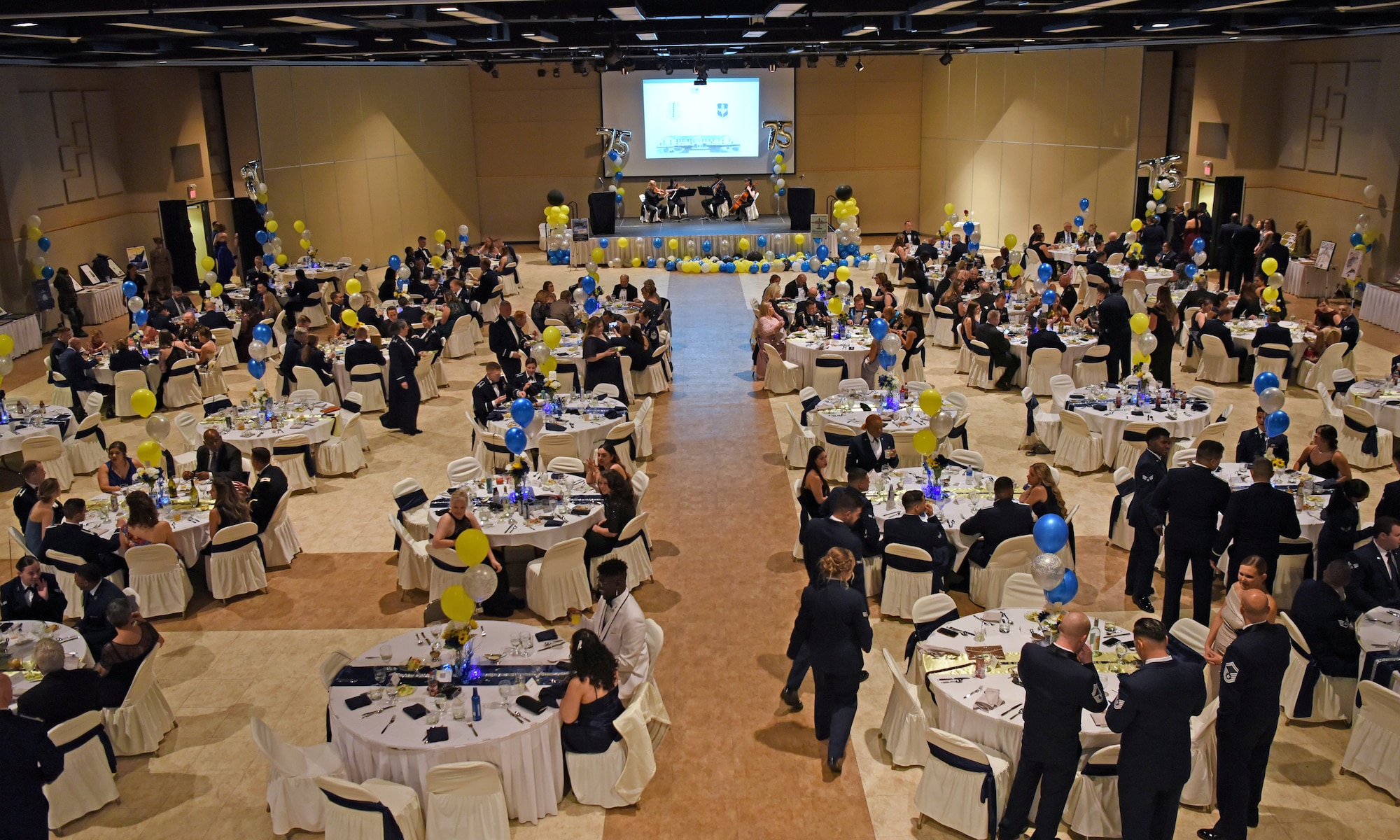 Members assigned to the 17th Training Wing gather for the annual Air Force Ball, at the McNease Convention Center, in San Angelo, Texas, Sept. 17, 2022. The ball shined a spotlight on the Air Force’s 75th anniversary, themed ‘Then and Now'. Attendees learned about the service’s past accomplishments and today’s achievements. (U.S. Air Force photo by Senior Airman Abbey Rieves)