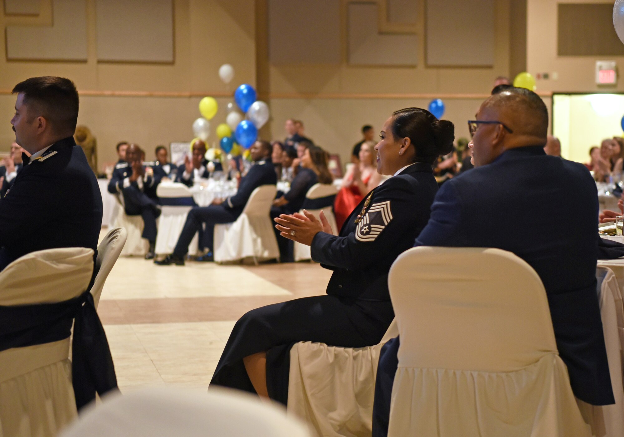 Members assigned to the 17th Training Wing applaud retired U.S. Air Force Gen. Lori Robinson, guest speaker and former 17th TRW commander, during the annual Air Force Ball, at the McNease Convention Center, in San Angelo, Texas, Sept. 17, 2022. More than 350 people attended the ball. (U.S. Air Force photo by Senior Airman Abbey Rieves)
