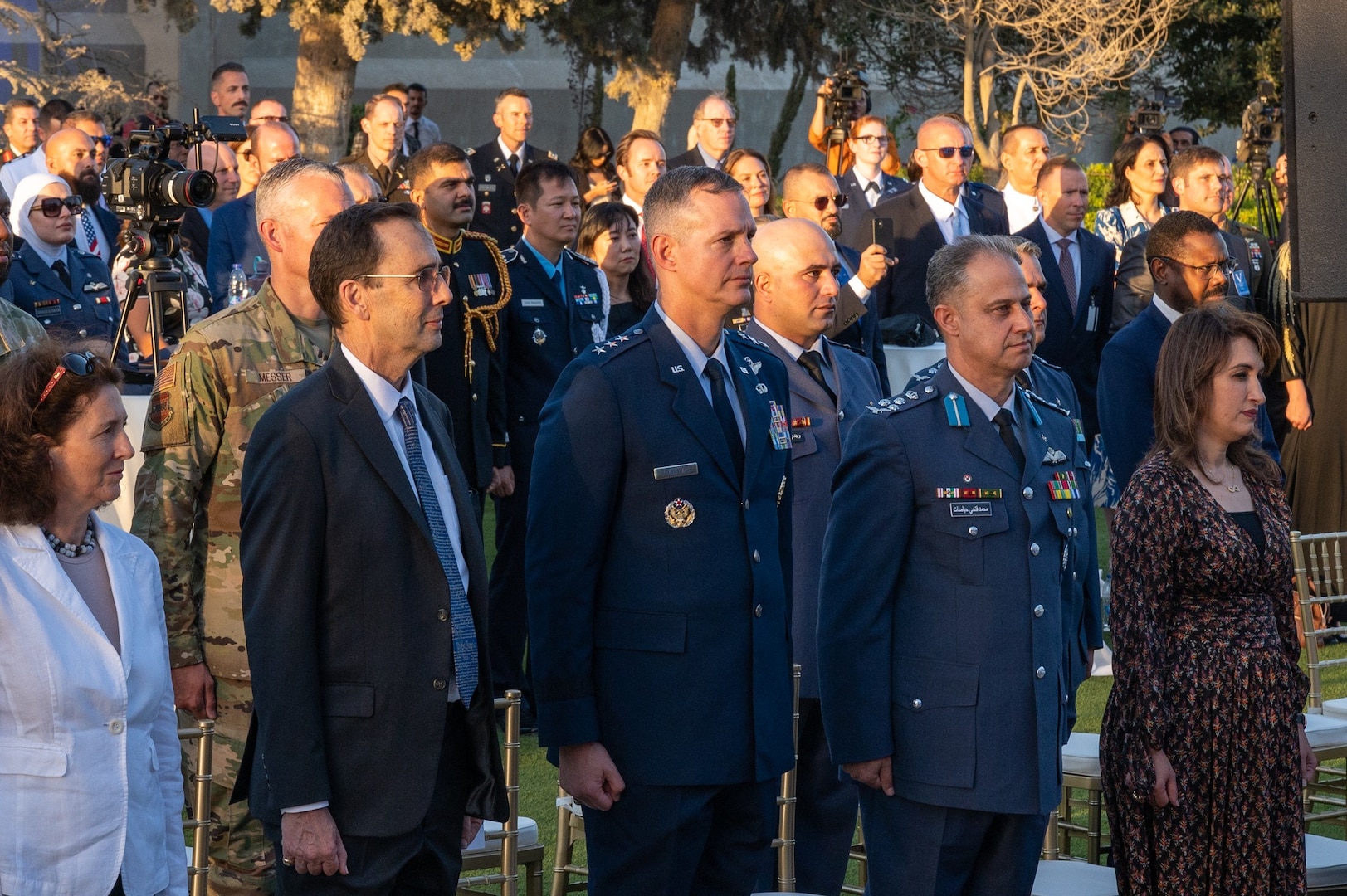 U.S. Air Force Lt. Gen. Alexus G. Grynkewich, Ninth Air Force (Air Forces Central) commander, stands for the U.S. National Anthem with leaders and representatives at the USAF 75th anniversary celebration at the U.S. Embassy in Amman, Jordan, Aug. 25, 2022.
