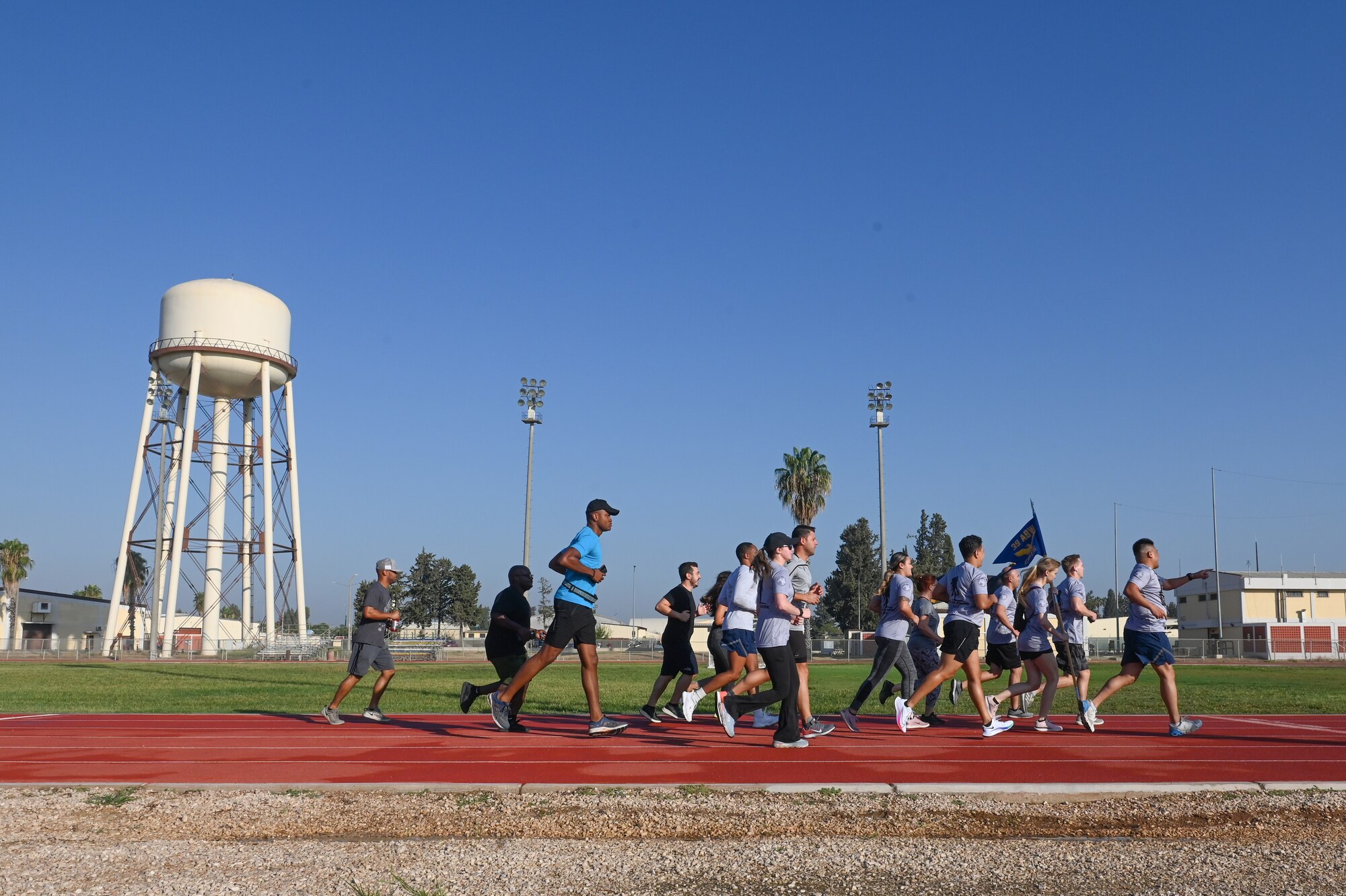 A group of people run.