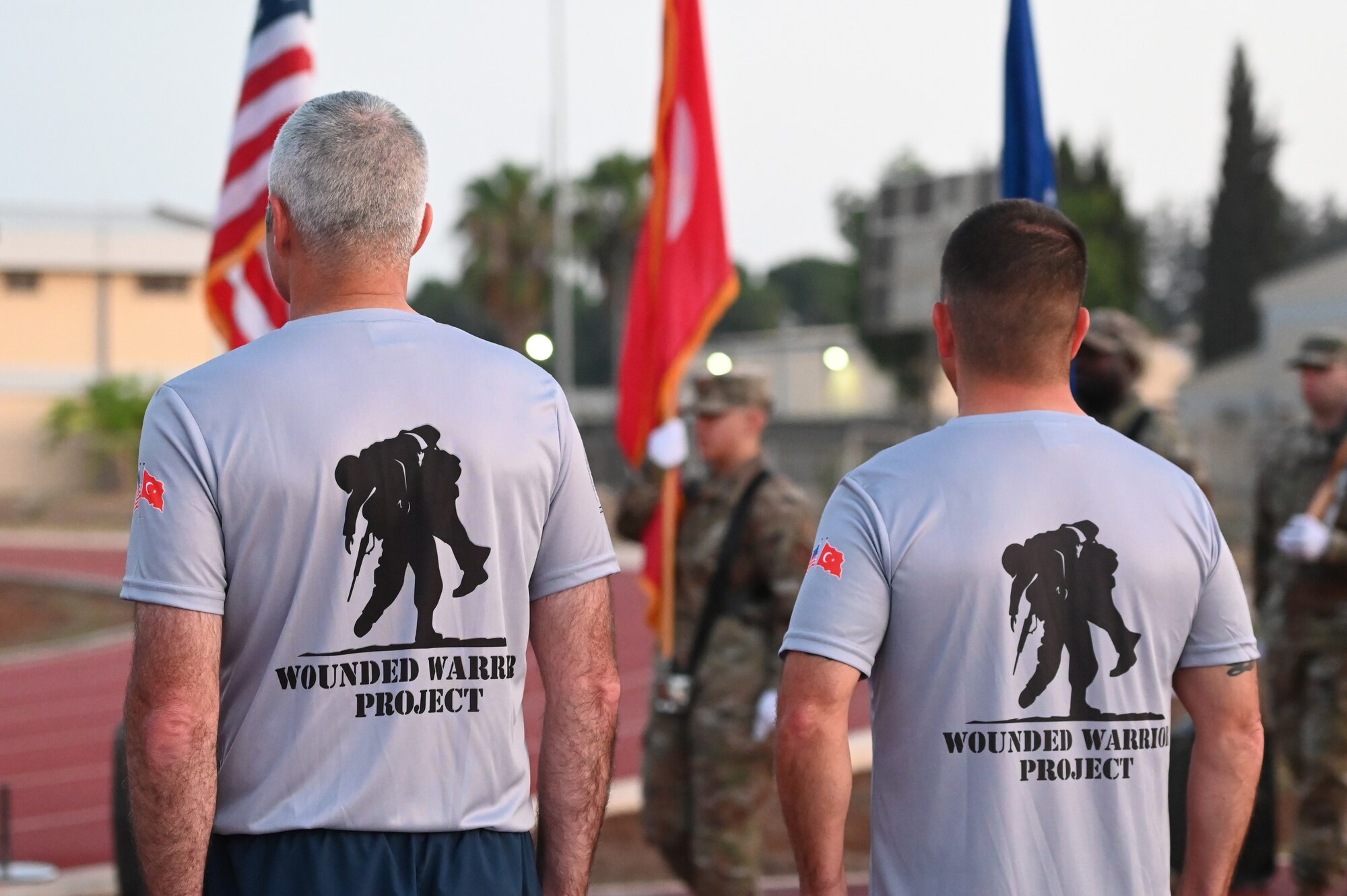 Men stand at attention.