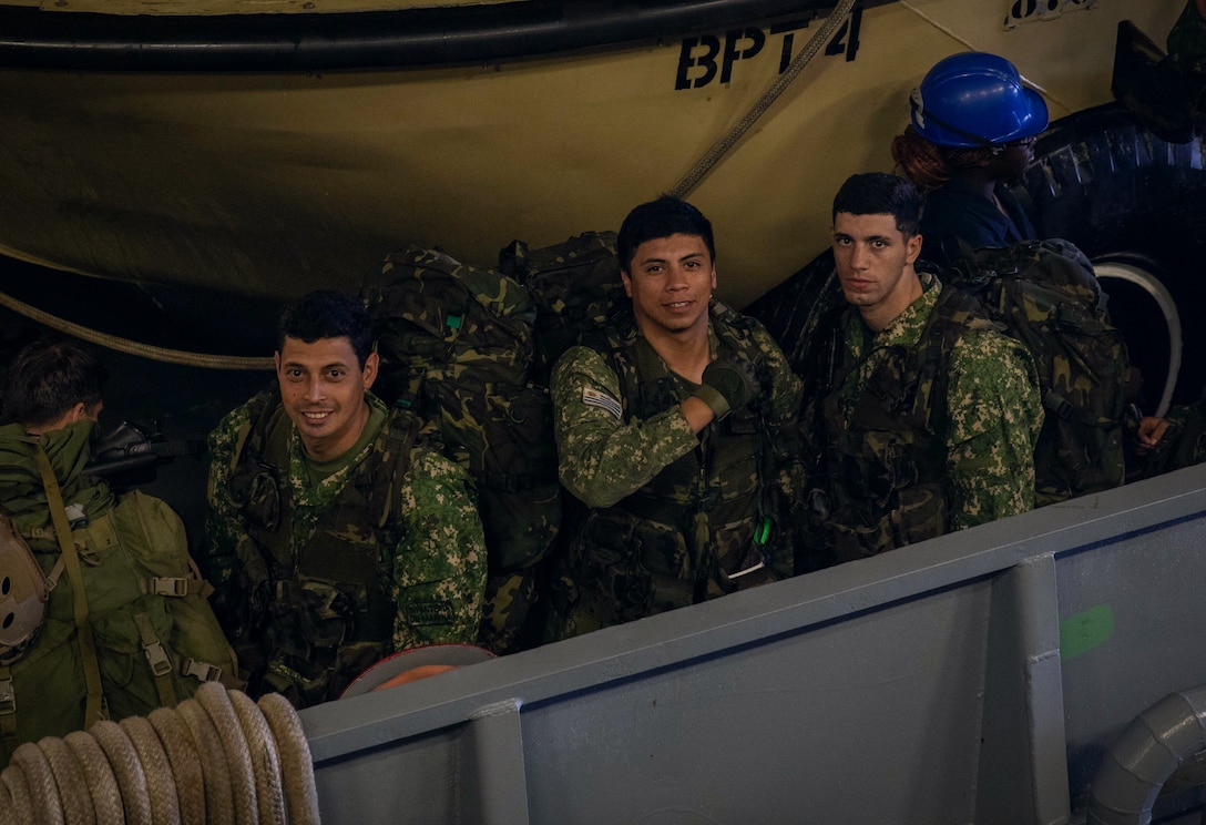 ATLANTIC OCEAN (Sept. 16, 2022) – Uruguayan marines pose for a photo prior to disembarking a landing craft, utility (LCU) in the well deck of the amphibious landing dock ship USS Mesa Verde (LPD 19) after returning from a multi-national amphibious assault with Brazilian and U.S. Marines, Sept. 16, 2022. Mesa Verde is currently underway in the Atlantic Ocean in support of exercise UNITAS LXIII. UNITAS is the world’s longest-running maritime exercise. Hosted this year by Brazil, it brings together multinational forces from Belize, Brazil, Cameroon, Chile, Colombia, Dominican Republic, Ecuador, France, Guyana, Jamaica, Mexico, Namibia, Panama, Paraguay, Peru, South Korea, Spain, United Kingdom, Uruguay, and the United States conducting operations in and off the coast of Rio de Janeiro. The exercise trains forces to conduct joint maritime operations through the execution of anti-surface, anti-submarine, anti-air, amphibious and electronic warfare operations that enhance warfighting proficiency and increase interoperability among participating naval and marine forces. (U.S. Navy photo by Mass Communication Specialist 3rd Class Sydney Milligan)