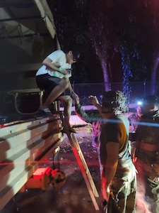 Puerto Rico National Guard Soldiers from the 125th Military Police Battalion help rescue families trapped by floods during the passing of Hurricane Fiona. The Guard prepositioned personnel and heavy equipment in nine locations before the storm.