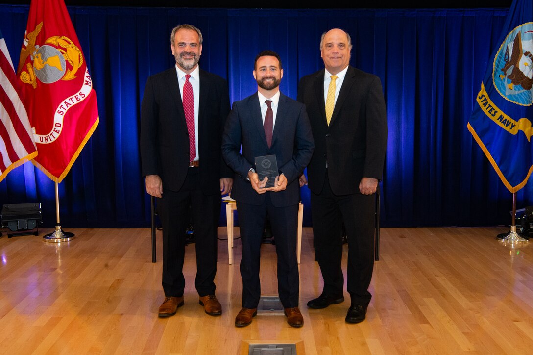 Assistant Secretary of the Navy for Research, Development and Acquisition Mr. Tommy Ross, Solomon, and Mr. Jay Stefany, Principal Civilian for Deputy to the Assistant Secretary of the Navy for Research, Development and. Acquisition stand for photo of the Dr. Delores M. Etter Top Scientists and Engineers of the Year Award for 2021.