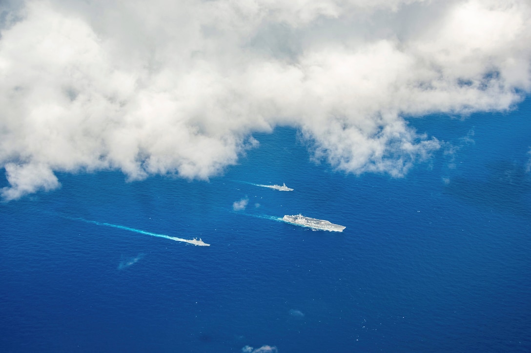 Three ships sail in formation.