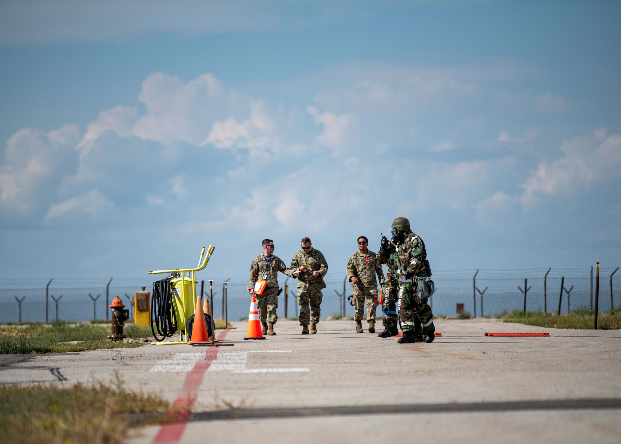 Airmen from the 421st Fighter Generation Squadron conduct post-attack reconnaissance sweeps during a Phase II readiness exercise, September 15th, 2022, held on Hill Air Force Base, Utah.  The exercise consisted of self-aid buddy care, chemical attacks, and their ability to survive and operate in a simulated deployed scenario. (U.S. Air Force photo by Staff Sgt. Codie Trimble)