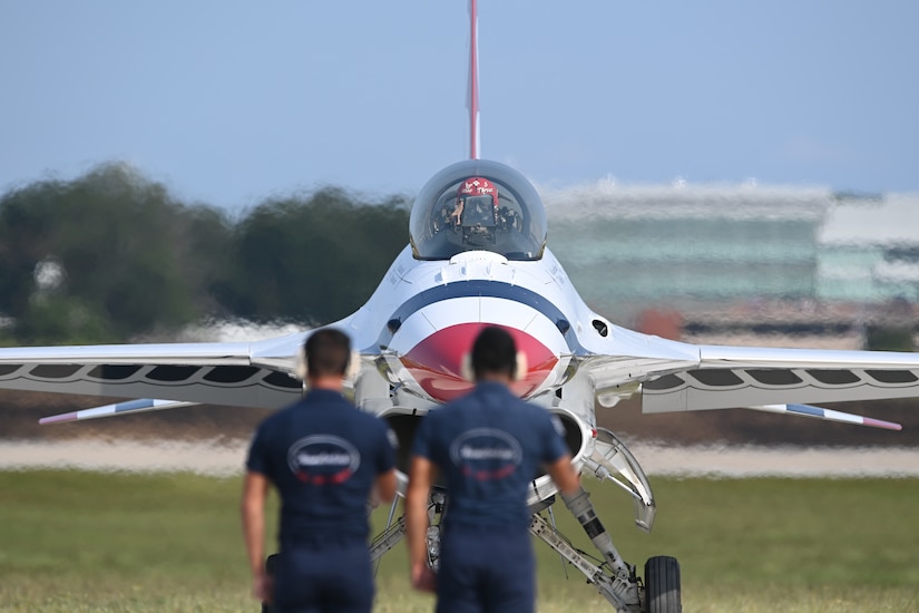 Maj. Jake “Primo” Impellizzeri, advance pilot/narrator for the U.S. Air Force Air Demonstration Squadron, the Thunderbirds, salutes his ground crew prior to takeoff at the Joint Base Andrews 2022 Air & Space Expo at JBA, Md., Sept. 17, 2022.