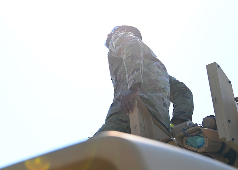 A U.S. Army soldier views aerial performances during the Joint Base Andrews 2022 Air & Space Expo at JBA, Md., Sept. 17, 2022.